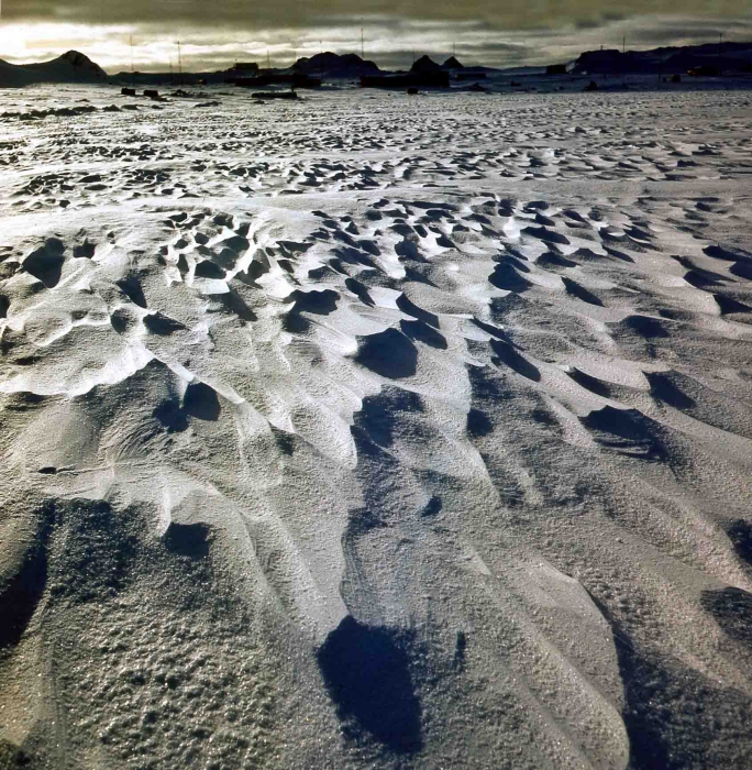 frosted snowdrifts (sastrugi) on the sea before the station
