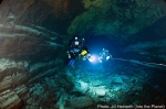 Rebreather divers following guideline in the submarine lava tube cave at Jameos del Agua, Lanzarote, Canary Islands.